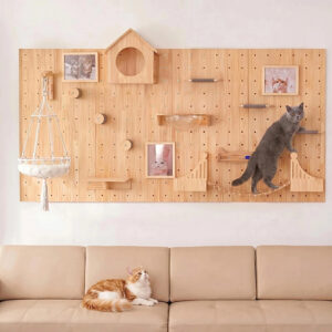 Pegboard cat wall deluxe set in natural pine wood with wide horizontal layout, macramé hammock, rope bridge, circular wooden steps, cat house, and track toy above a beige sofa